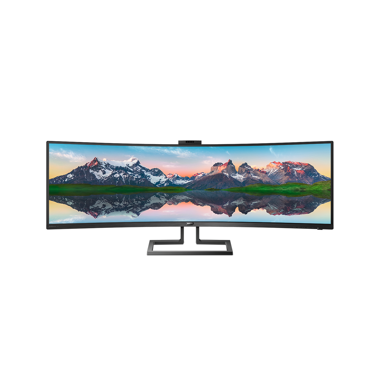 Un ampio monitor Philips curvo mostra un paesaggio montano con cime innevate riflesse in un lago.