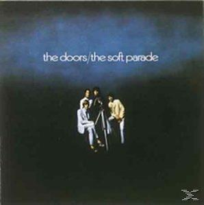 Albumcover: The Doors, vier Figuren in einer Reihe, Titel in Weiß. Dunkler, blauer Hintergrund.