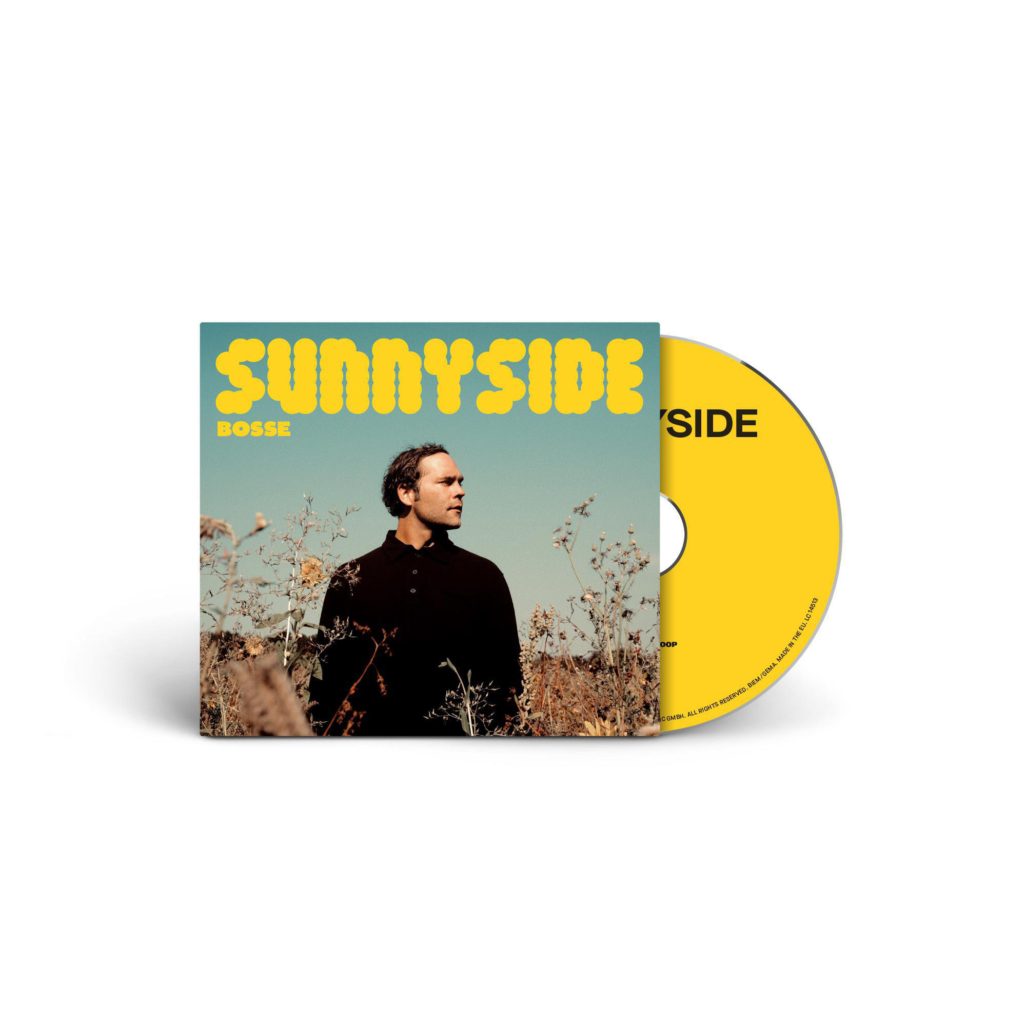 Ein CD-Cover mit einem Mann in schwarzem Hemd auf einem Feld und dem Titel 'SUNNYSIDE' in gelben Buchstaben.