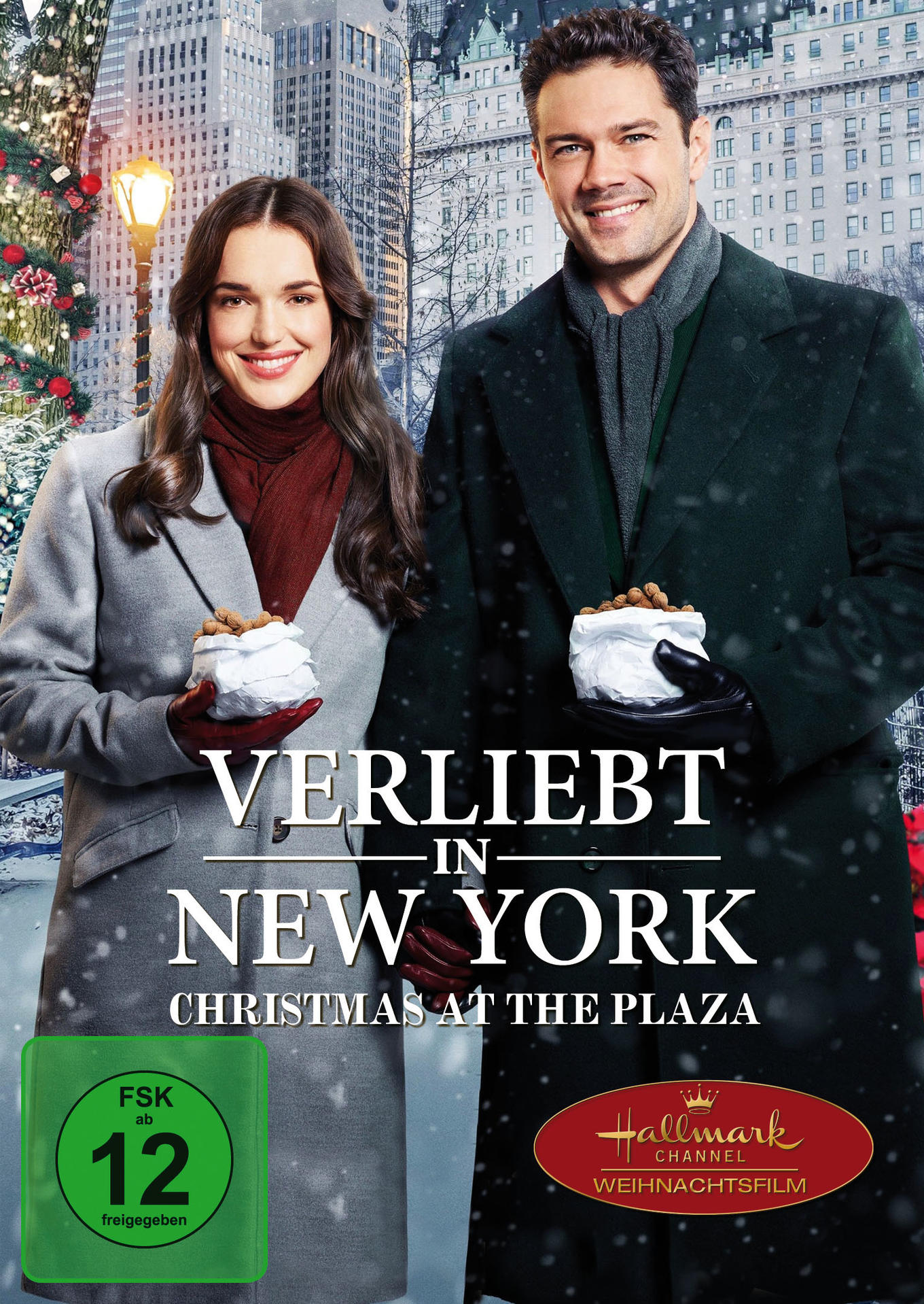 Filmcover mit einem Paar, das Gebäck vor einem verschneiten New York City-Hintergrund hält, Filmtitel sichtbar.