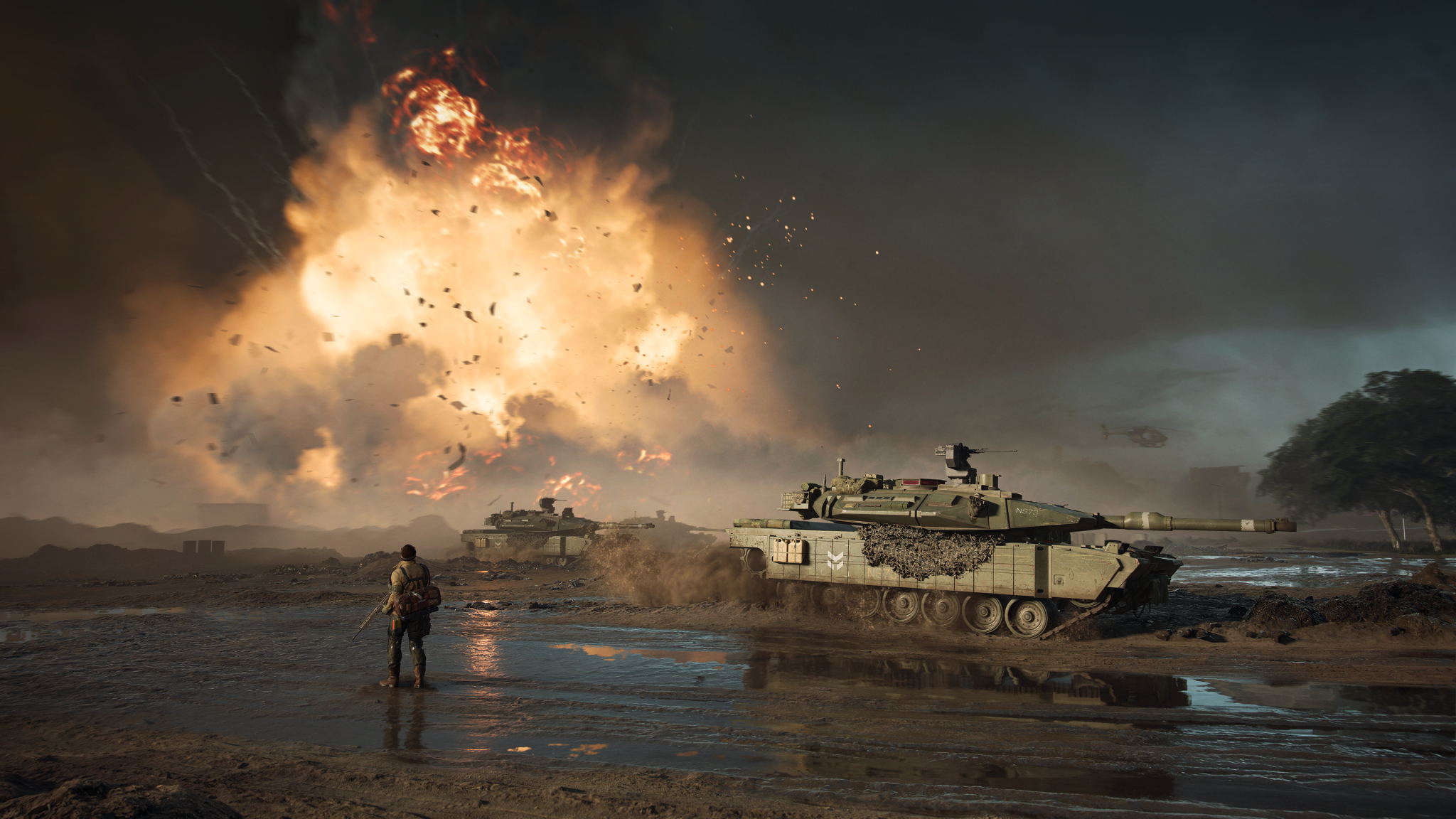 Slagveld met tanks, explosies en een soldaat in een woestijnomgeving.