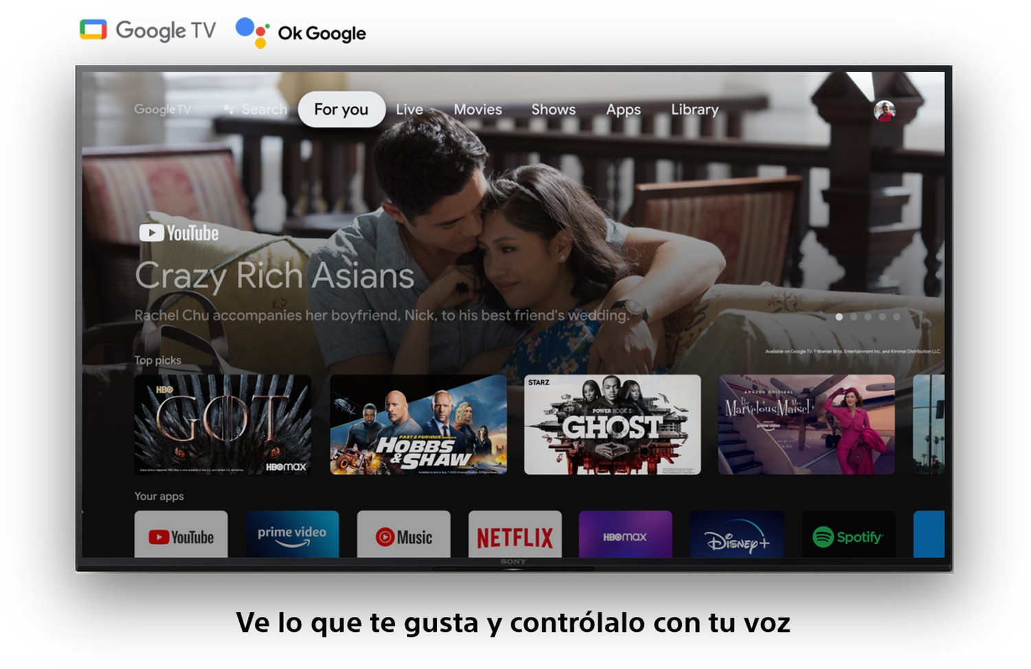 Un televisor muestra un video de YouTube de una pareja. El televisor también muestra aplicaciones y películas.