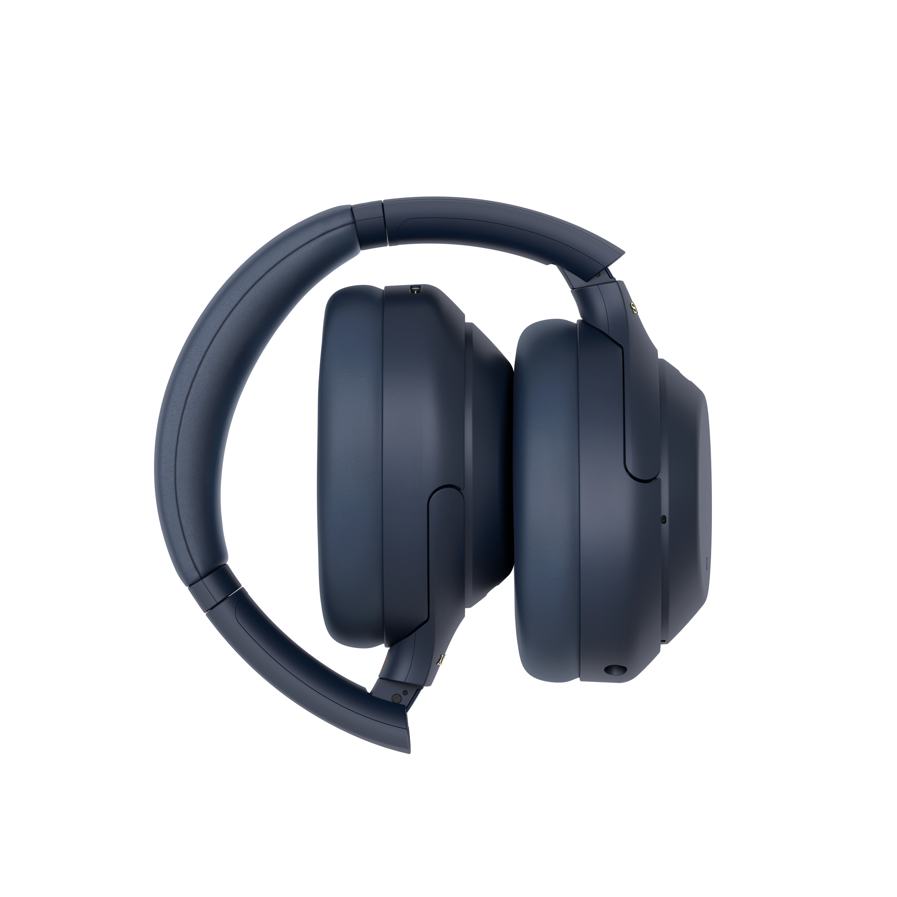 Auriculares azules plegados. Los auriculares son circulares y la diadema está curvada.