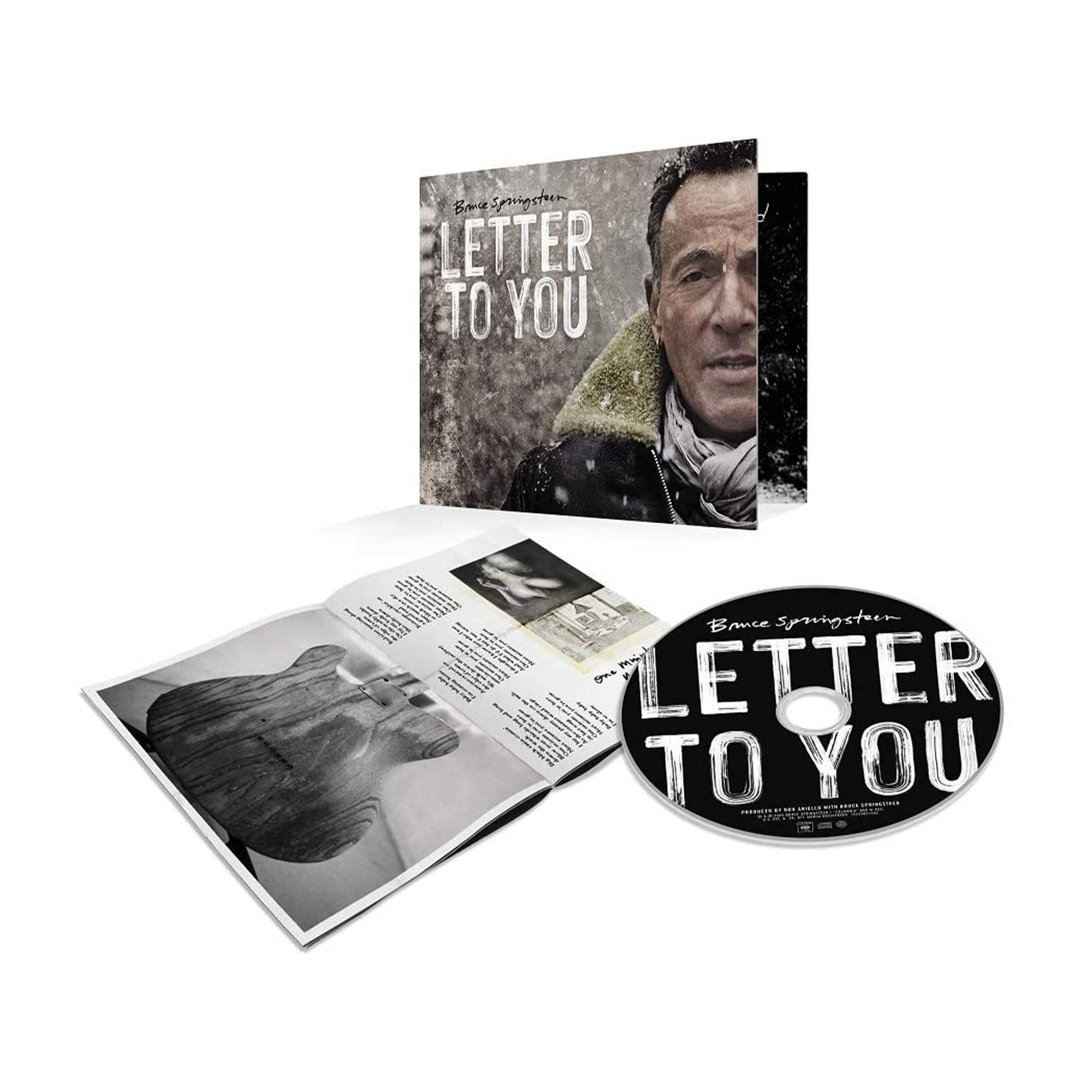 Copertina del CD di Bruce Springsteen aperta con CD e testi. Neve e cantante.