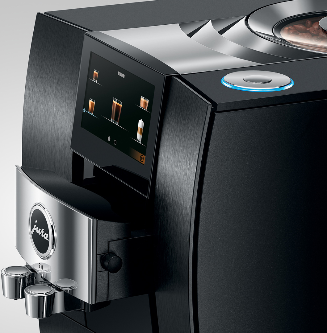 Macchina da caffè nera con touchscreen e finiture cromate.