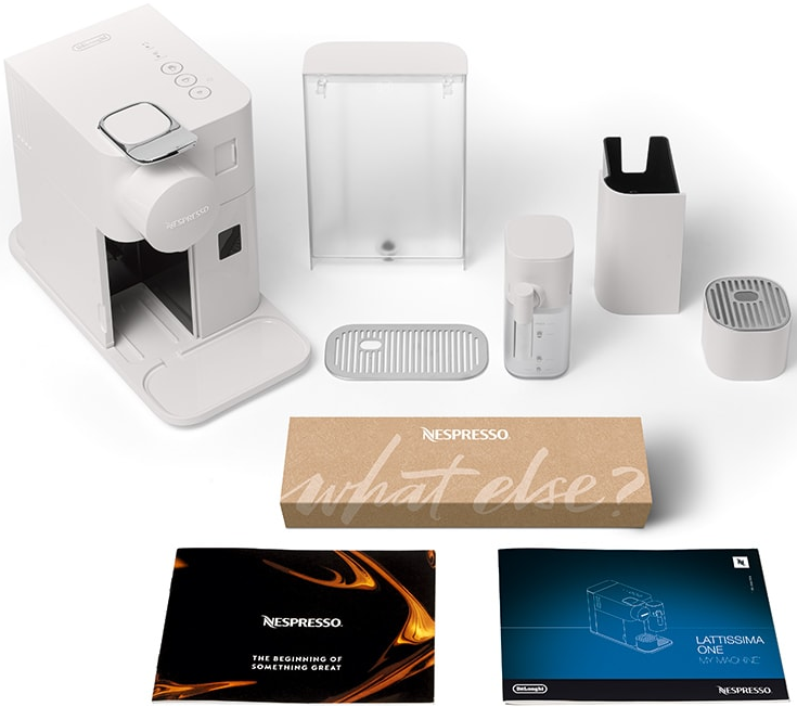 Machine à café Nespresso blanche avec accessoires et boîte.