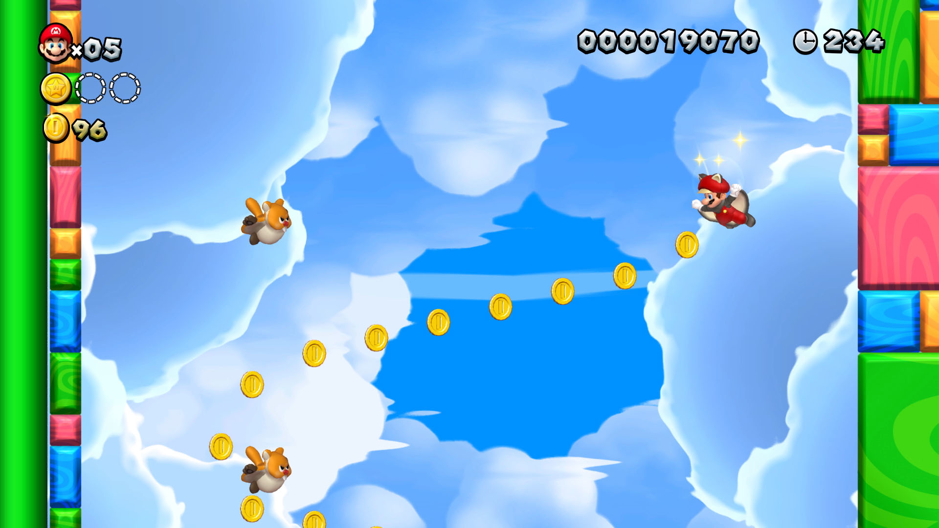 Uno schermo di un videogioco con Mario che vola, raccogliendo monete in un cielo blu.
