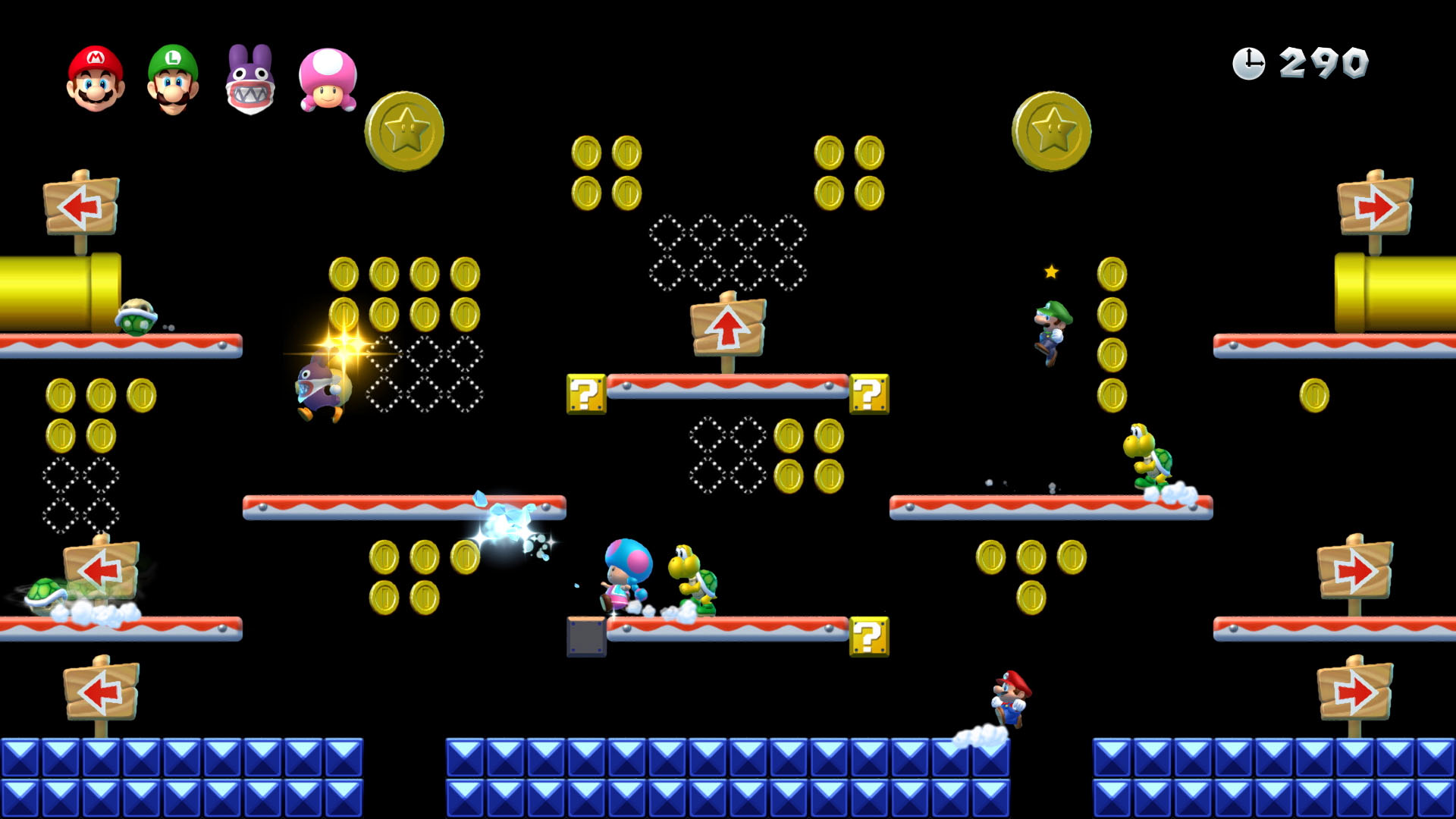 Screenshot di un livello di Super Mario Bros, con Mario, Luigi e altri personaggi.