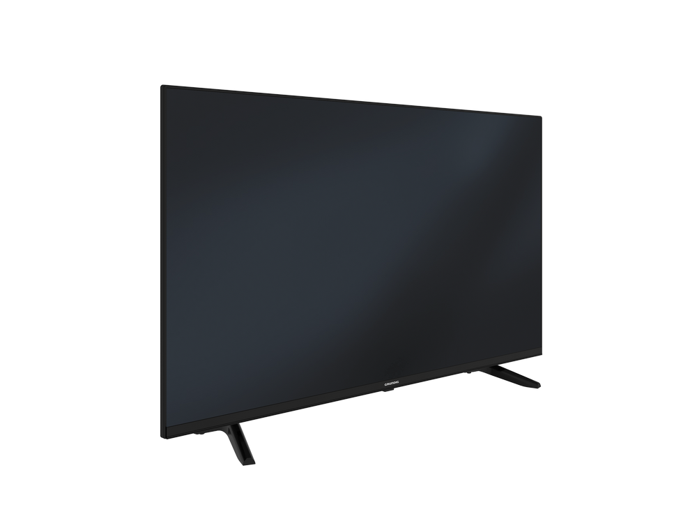 Un televisor de pantalla plana negro está inclinado sobre patas negras sobre un fondo gris. La pantalla está oscura y la marca es visible.
