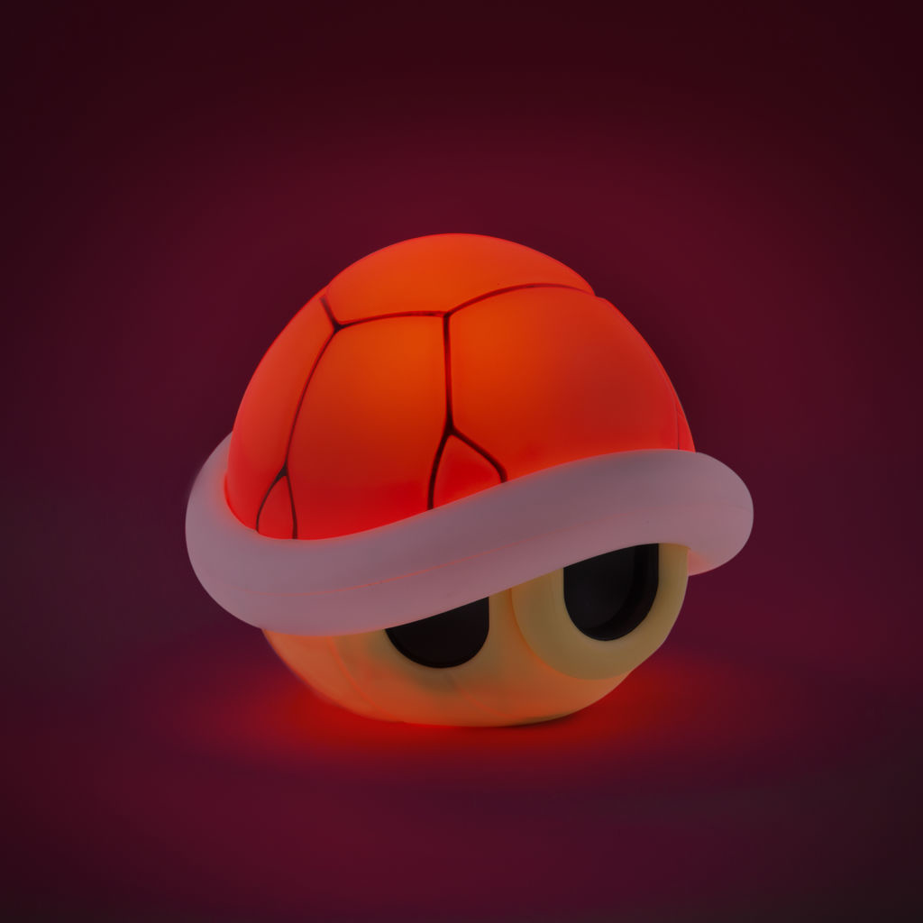 Rote und orangefarbene Schildkrötenlampen. Die Lampe ist auf einem dunkelroten Hintergrund.