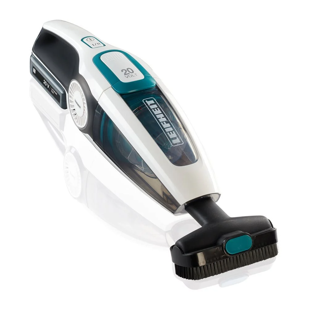 Un aspirateur à main blanc et sarcelle sur une surface réfléchissante.