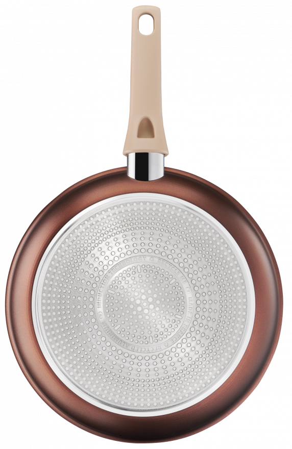 Brown frying pan bottom, with a tan handle. The pan is round, with a textured surface.