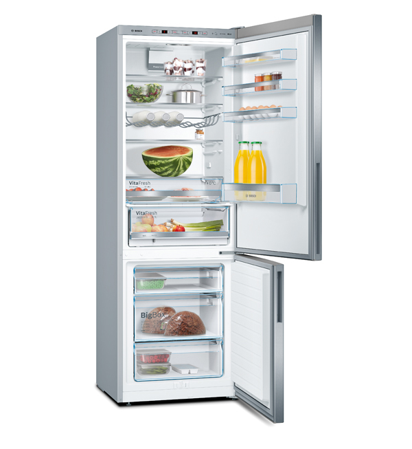 Open refrigerator interior. Visible shelves with food items like fruits, vegetables, drinks, and meat.
