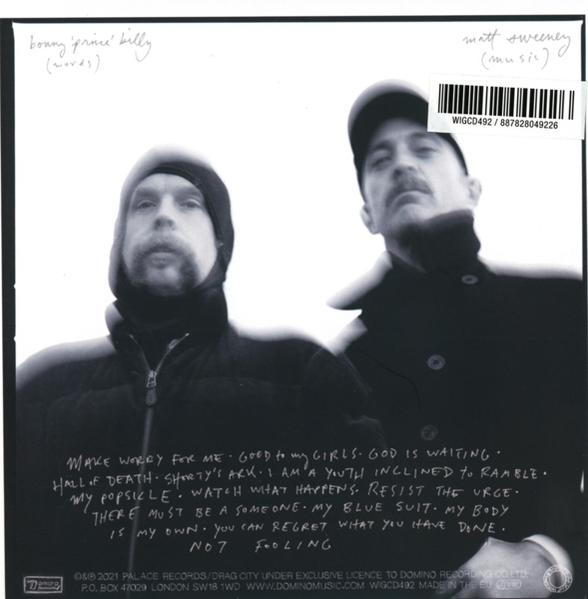 Albumcover mit zwei Männern und handgeschriebenen Texten. Schwarzweiß mit Textüberlagerung.