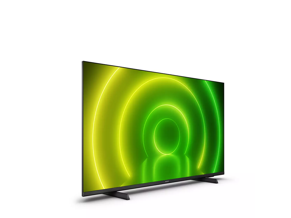 Televisor Philips mostrando círculos concéntricos verdes y amarillos. El televisor es negro con marco y soporte.