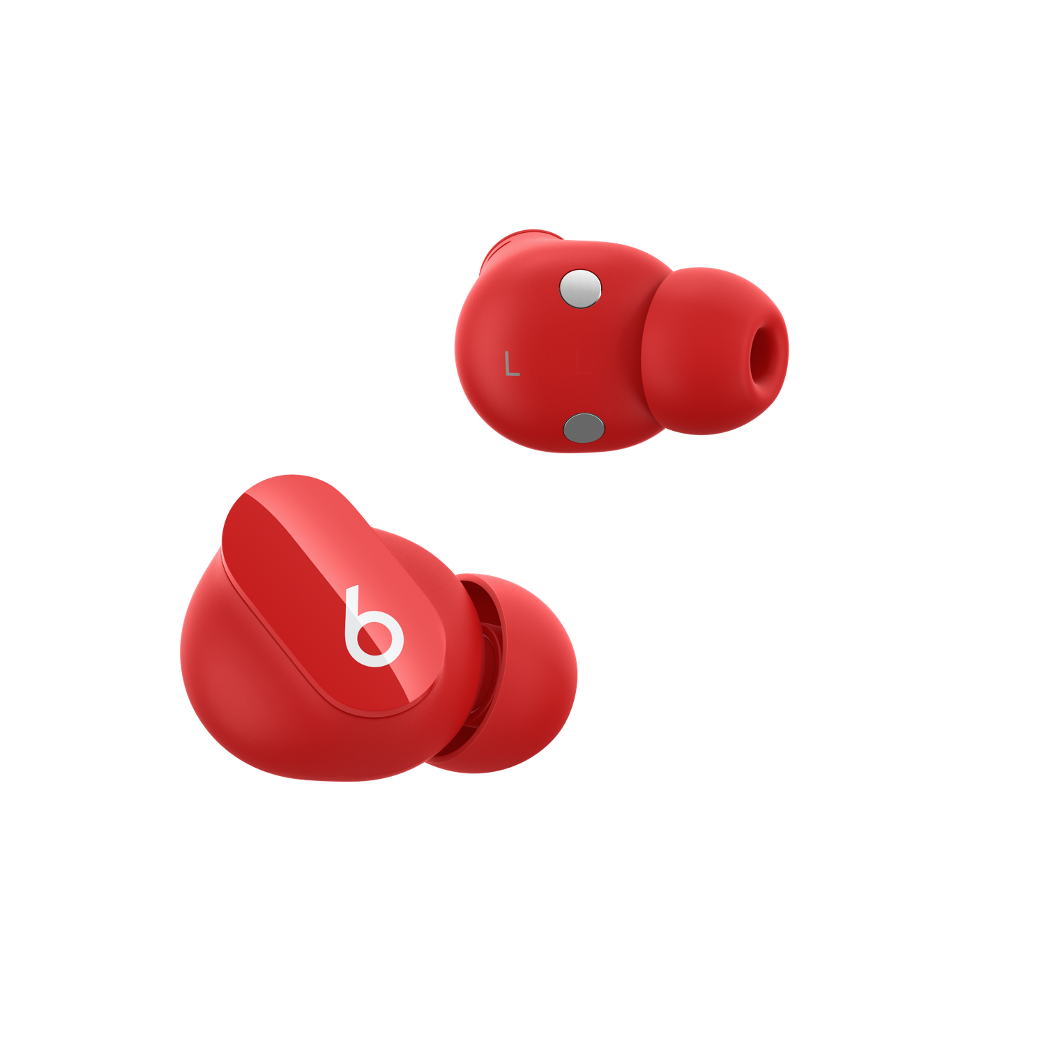 Auriculares inalámbricos rojos Beats Studio Buds sobre fondo negro, mostrando el logo 'b'.