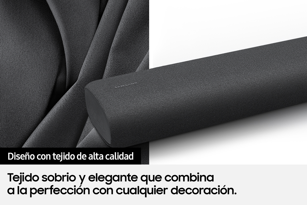Primer plano de una barra de sonido gris oscuro con texto en español. Muestra la textura de la tela.