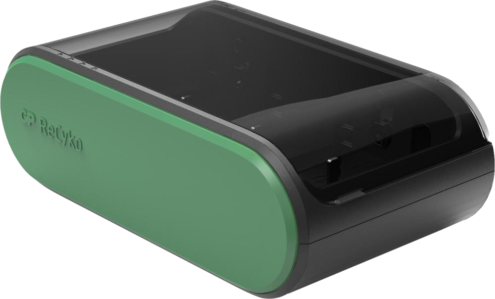 Appareil vert et noir, probablement un chargeur de batterie. Il a un design incurvé et un dessus noir.