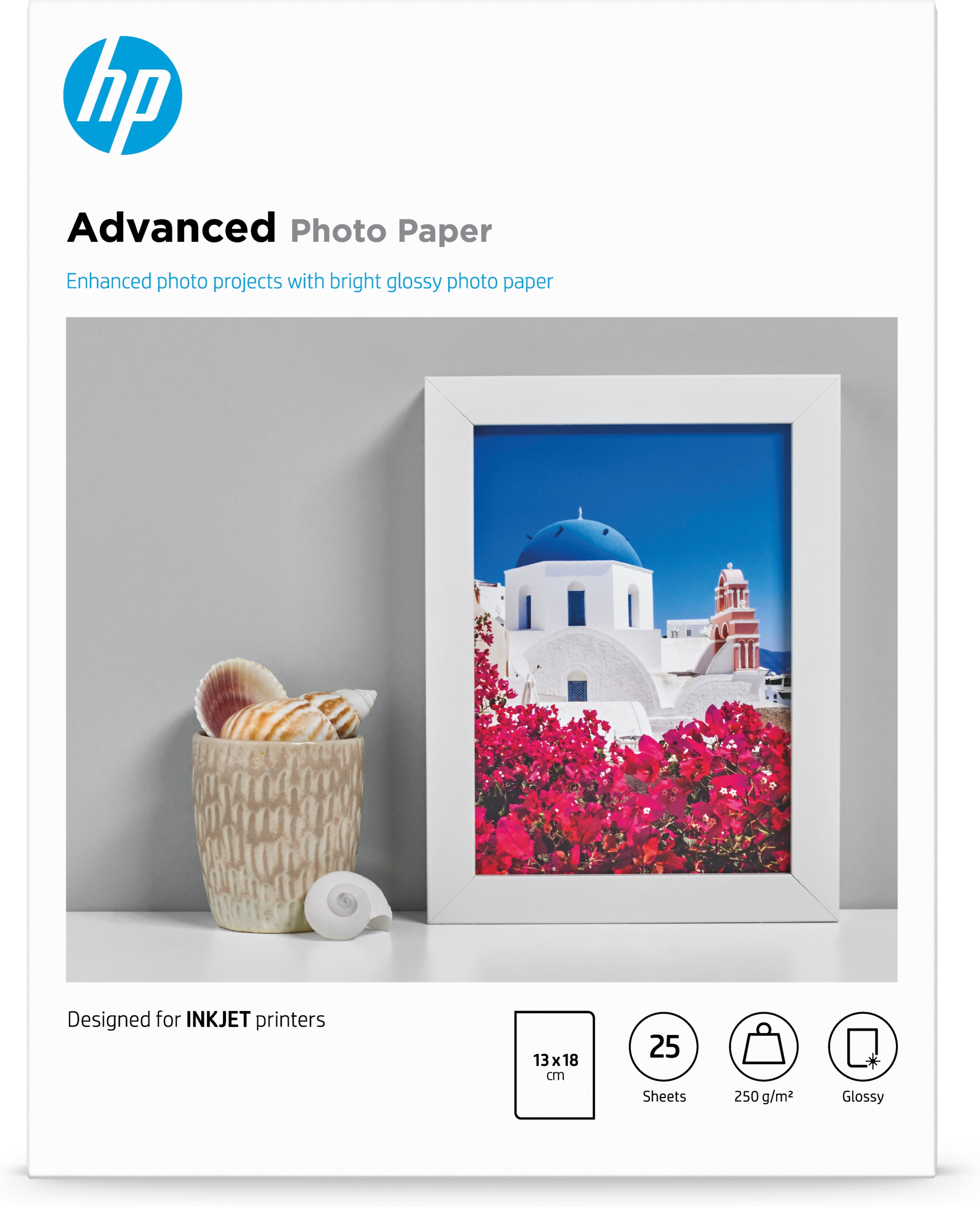 HP Fotopapierpackung mit gerahmtem Bild von weißen Gebäuden und roten Blumen.