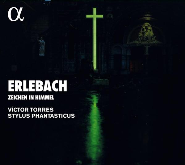 Albumhoes met de tekst 'ERLEBACH' en een groen kruis. Donkere achtergrond met een waterreflectie.