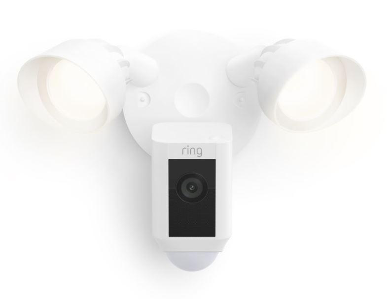 Weiße Ring-Flutlichtkamera mit zwei Lichtern und einer schwarzen Kamera mit weißer Wand.