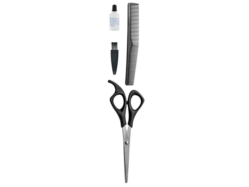 Herramientas de peluquería: tijeras, peine, aceite y un cepillo, dispuestos sobre una superficie blanca.