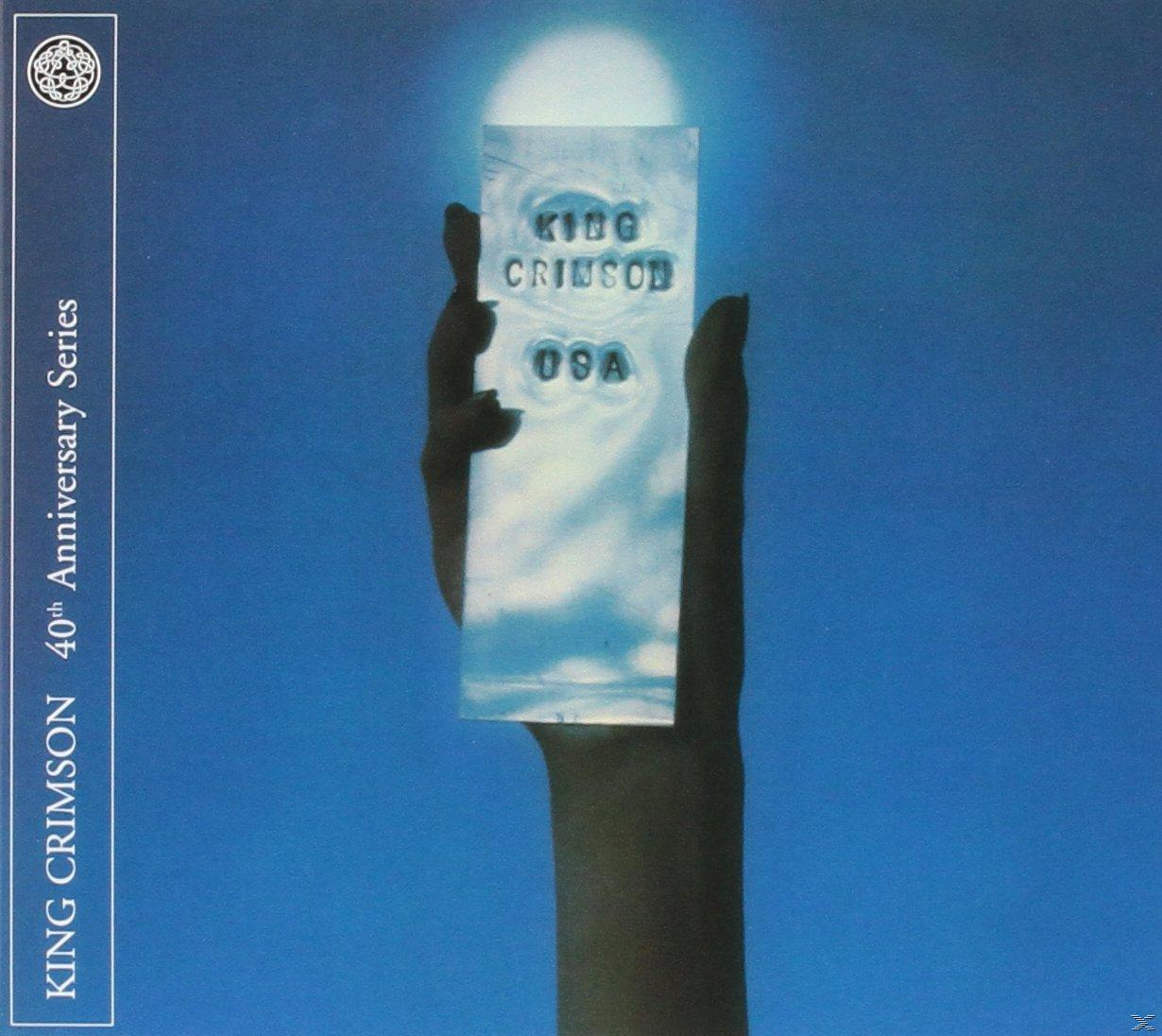 Album borító: kéz ezüst téglalapot tart. Szöveg: KING CRIMSON 40th Anniversary Series.