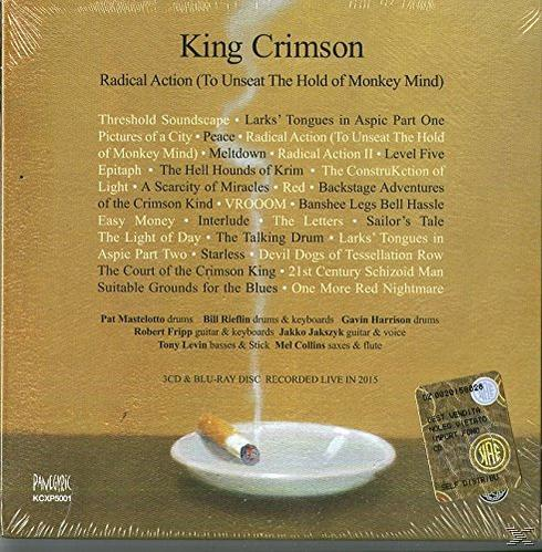 King Crimson album borítója. Album címe és a számlista arany háttéren. Hamutartóban egy cigaretta látható.