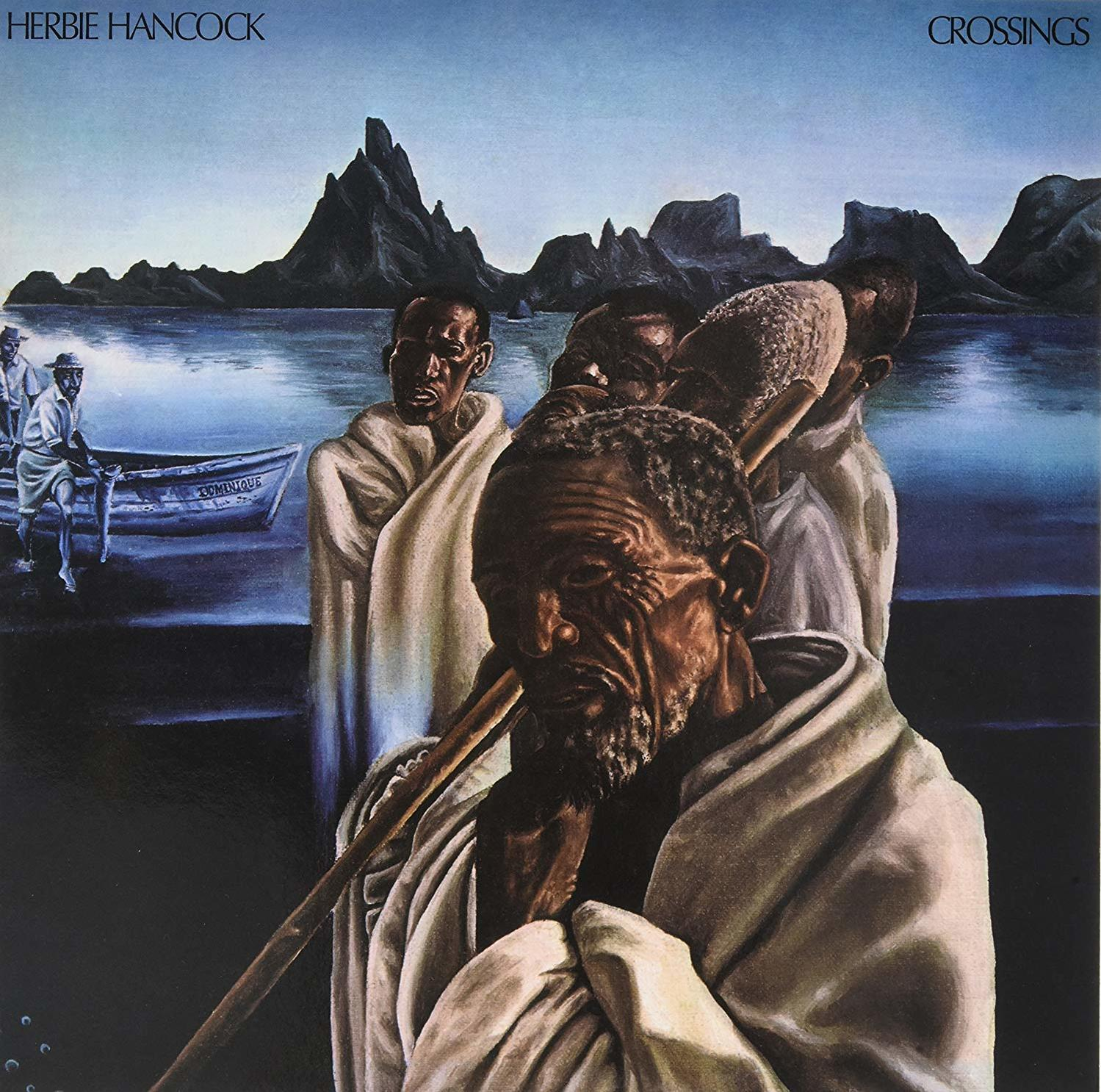 Album borító: Herbie Hancock Crossings. Fehér köntösös férfiak botokkal és egy csónak a háttérben.
