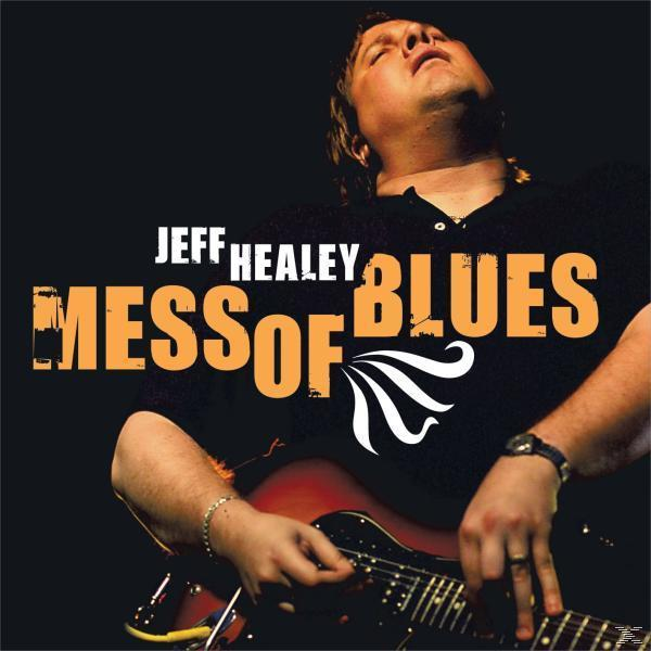 A 'Mess of Blues' Jeff Healey album borítója. Férfi gitározik, csukott szemmel. Narancssárga szöveg fekete háttéren.