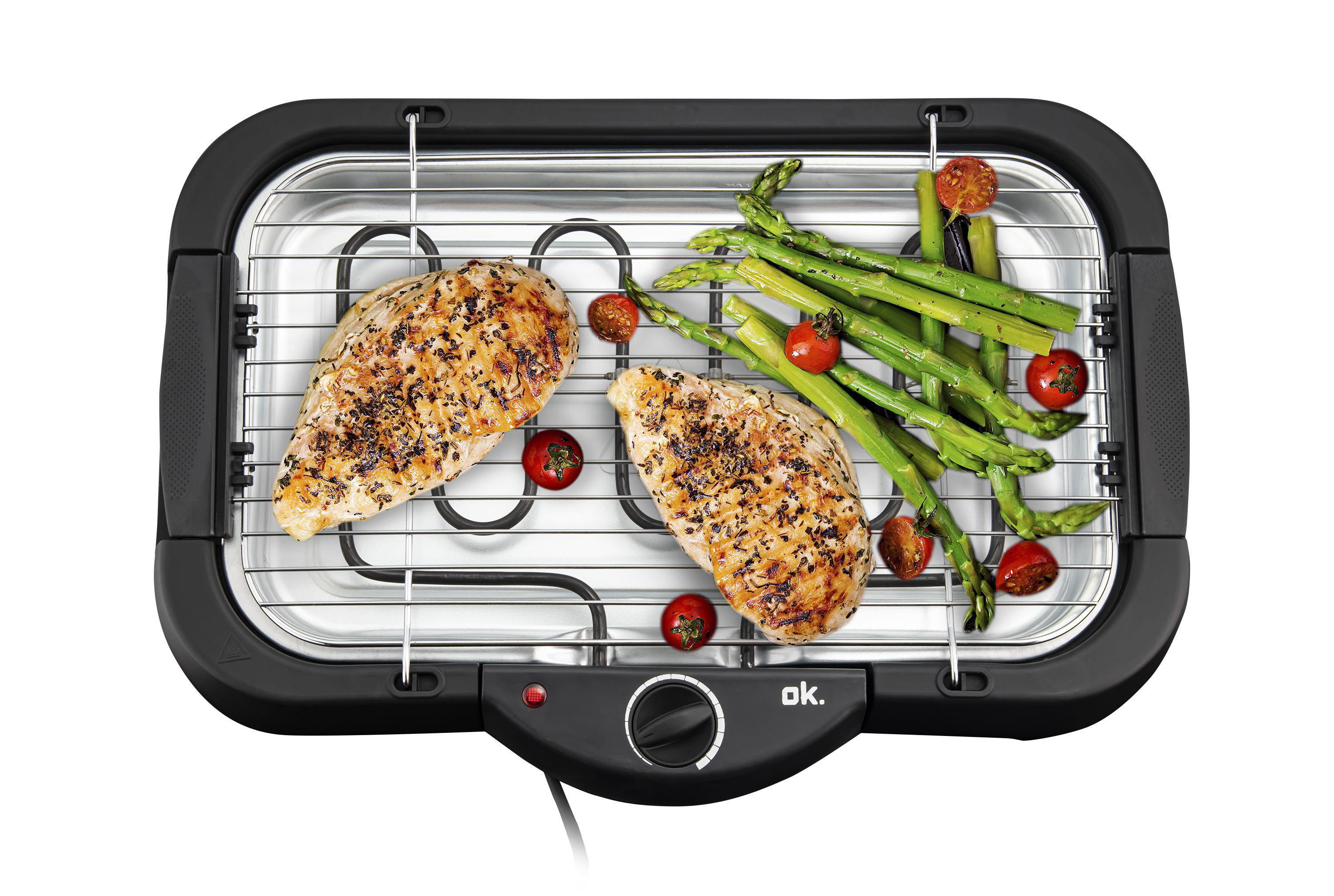 Elektrischer Grill mit gegrillten Hähnchenbrüsten, Tomaten und Spargel.