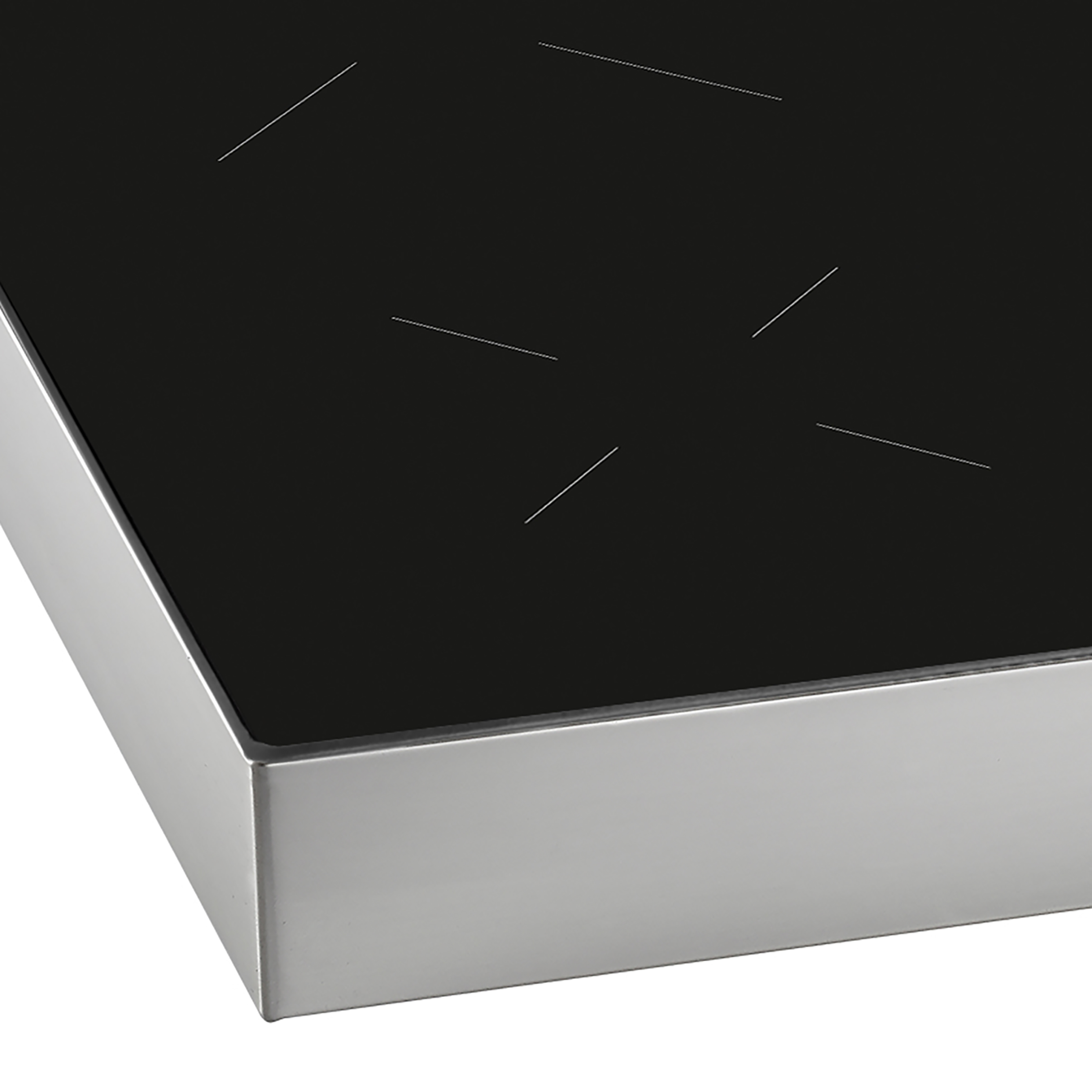 Close-up of a black stovetop with white markings and a silver metal frame.