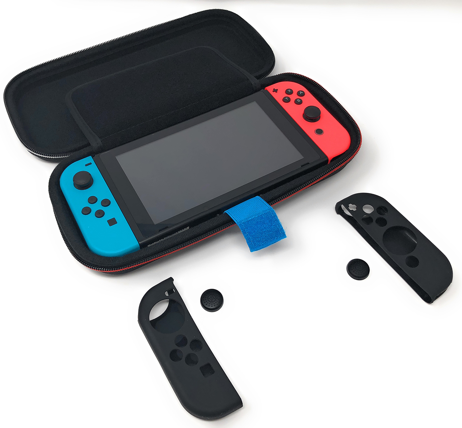 A Nintendo Switch console in a case. Also controllers and black accessories are visible.