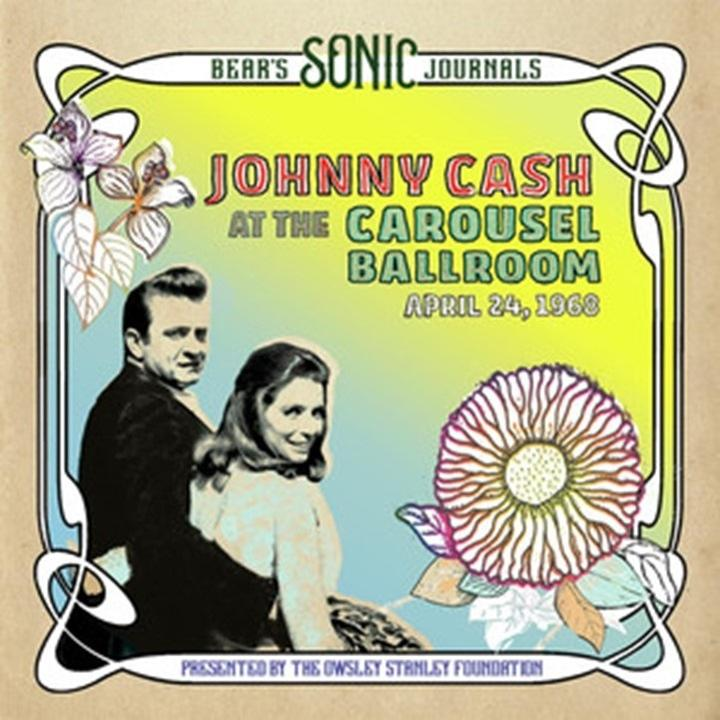 Pochette d'album de Johnny Cash. Johnny et June Carter Cash. Fond : fleur rose et vert clair.