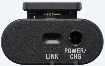 Nahaufnahme eines schwarzen Geräts mit den Aufschriften 'LINK' und 'POWER/CHG'.