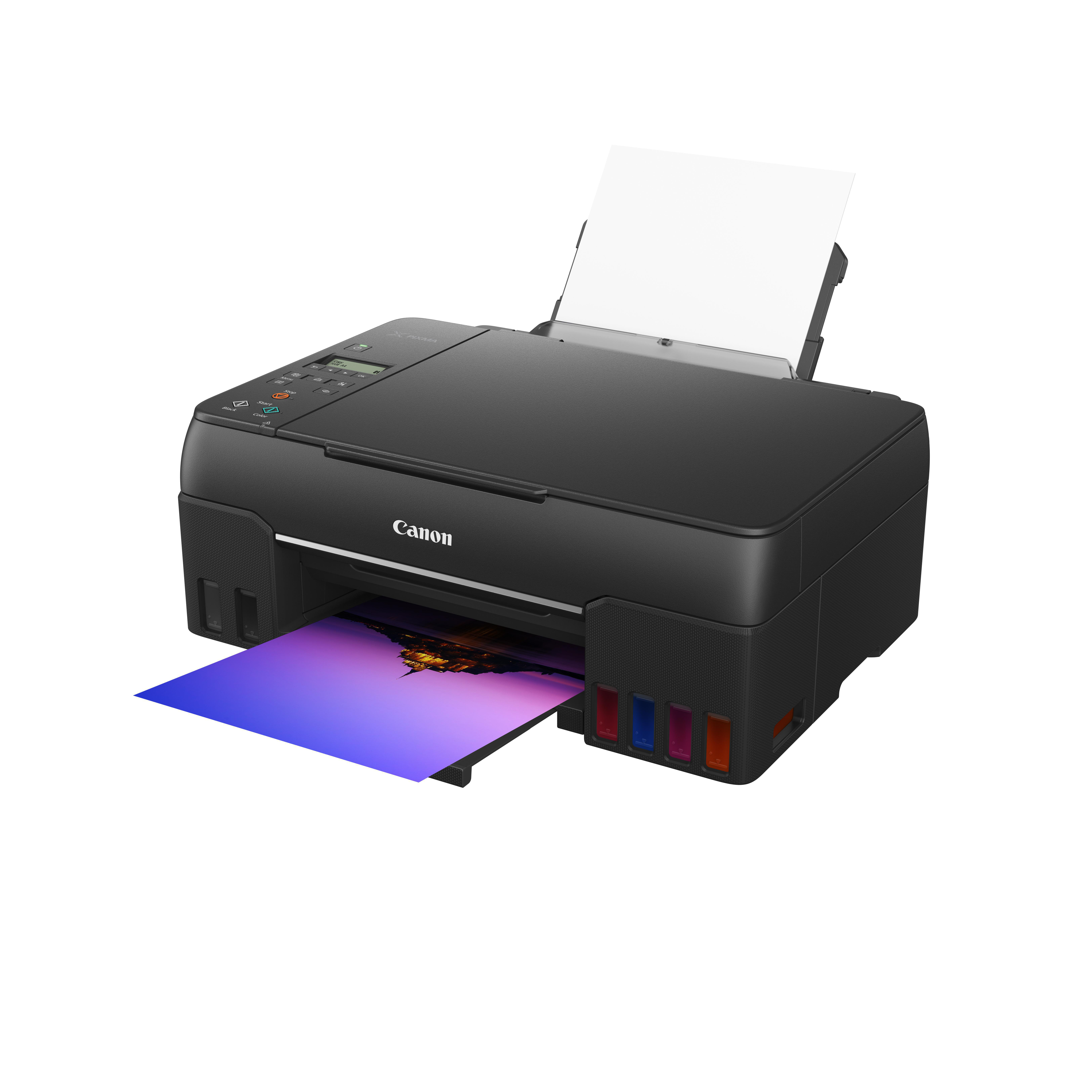 Schwarzer Canon-Drucker druckt farbiges Bild. Tintenpatronen seitlich sichtbar.