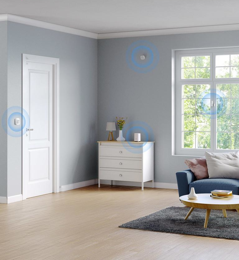 Living room with a door, window, sofa, and smart home devices.