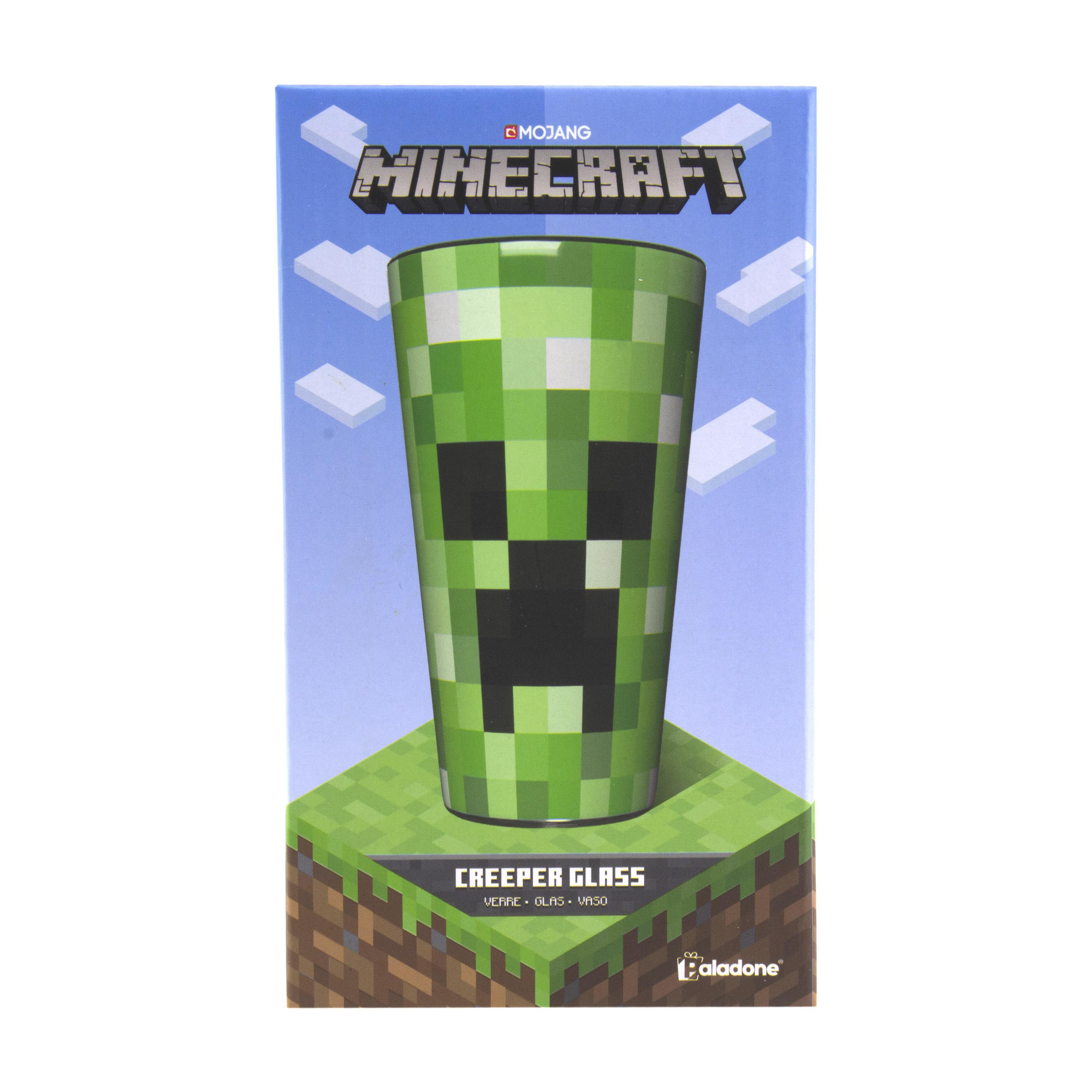 Minecraft-Glas mit Creeper-Gesicht auf grün-braunem Block-Hintergrund.