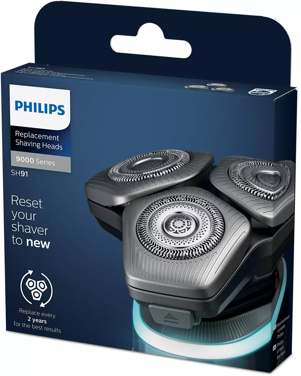 Schachtel mit Philips-Ersatzscherköpfen. Drei Köpfe sind sichtbar. Text: 'Setzen Sie Ihren Rasierer zurück'.