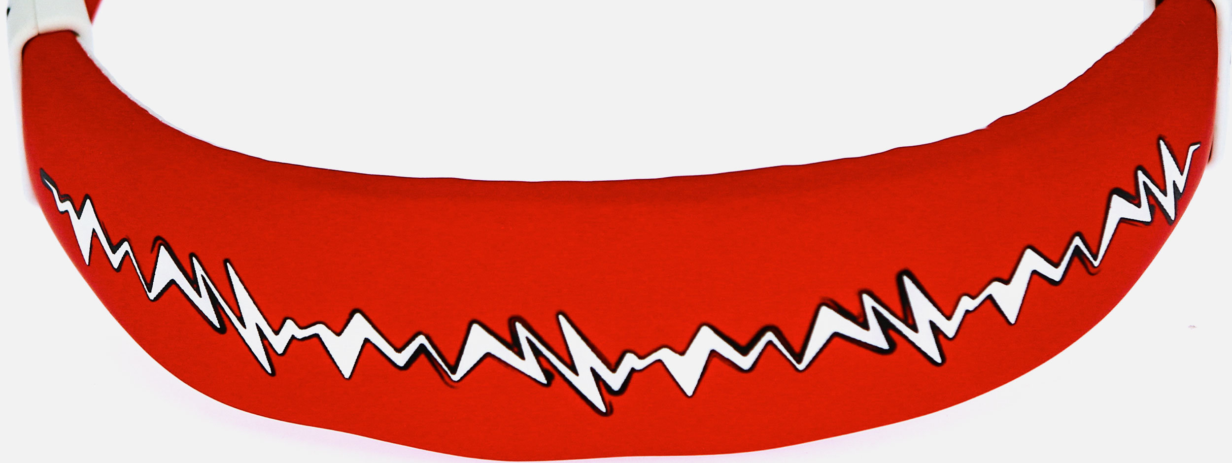 Fascia per la testa rossa e bianca a fantasia. Il motivo è costituito da linee a zig-zag bianche sulla superficie rossa.