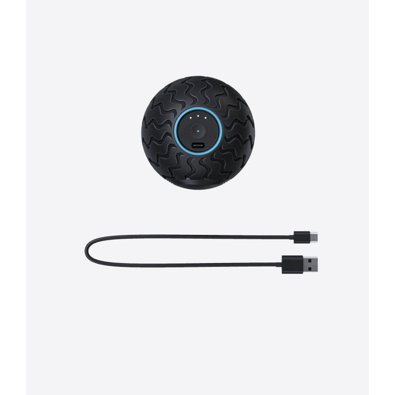 Bola de masaje vibratoria negra con centro azul y cable USB negro.