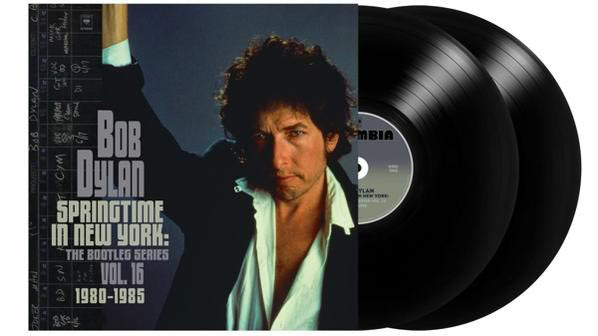 Bob Dylans 'Springtime in New York' Album. Schwarze Vinyls mit Albumcover, das Dylans Gesicht und Text zeigt.
