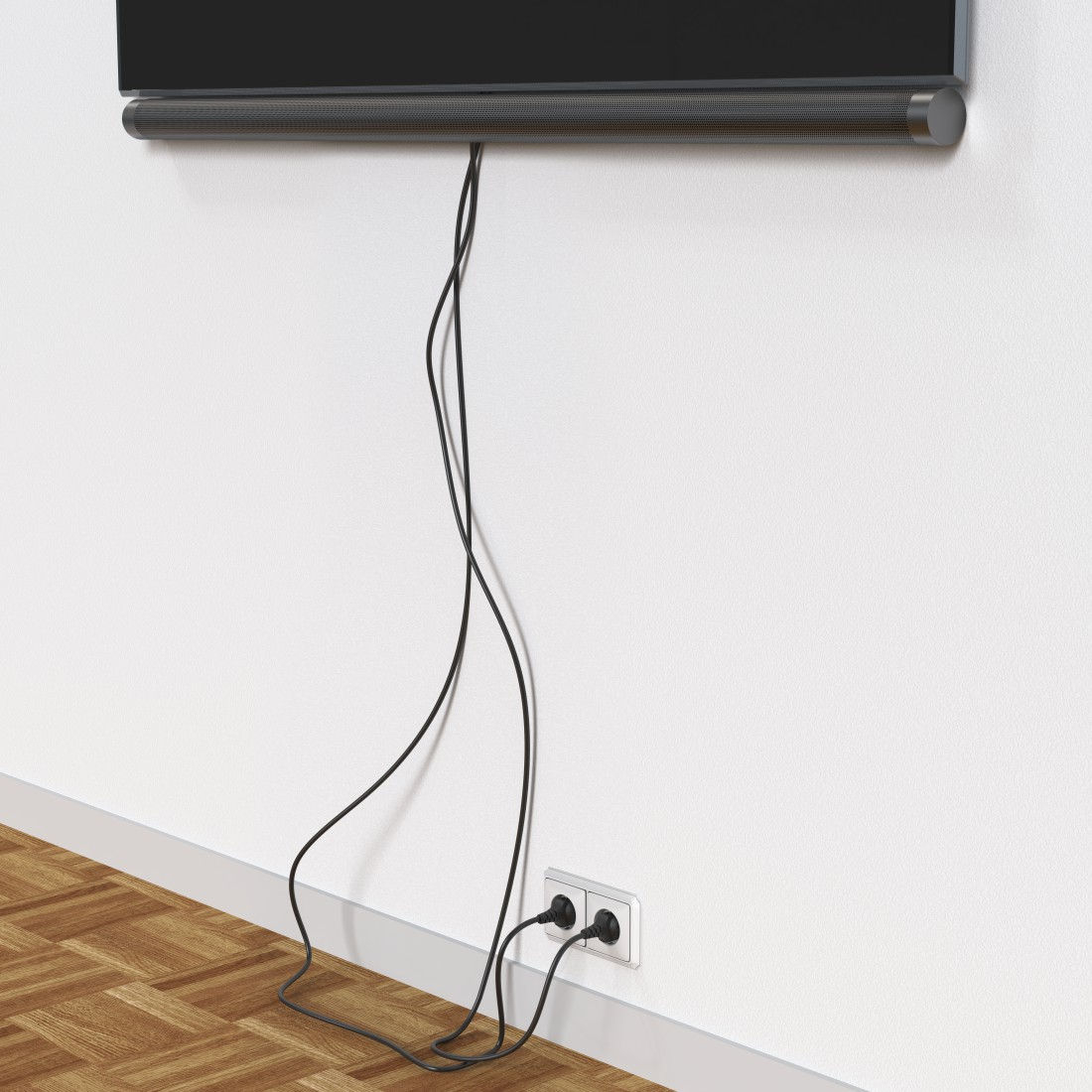 Schwarze TV-Soundbar an weißer Wand montiert mit schwarzen Kabeln, die an eine Steckdose angeschlossen sind.