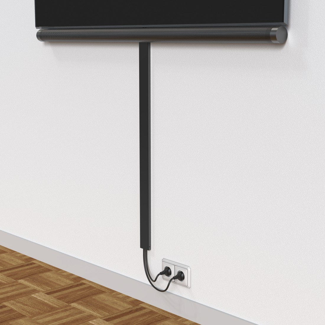Eine Wand mit TV, schwarzem Kabelkanal und Steckdose.
