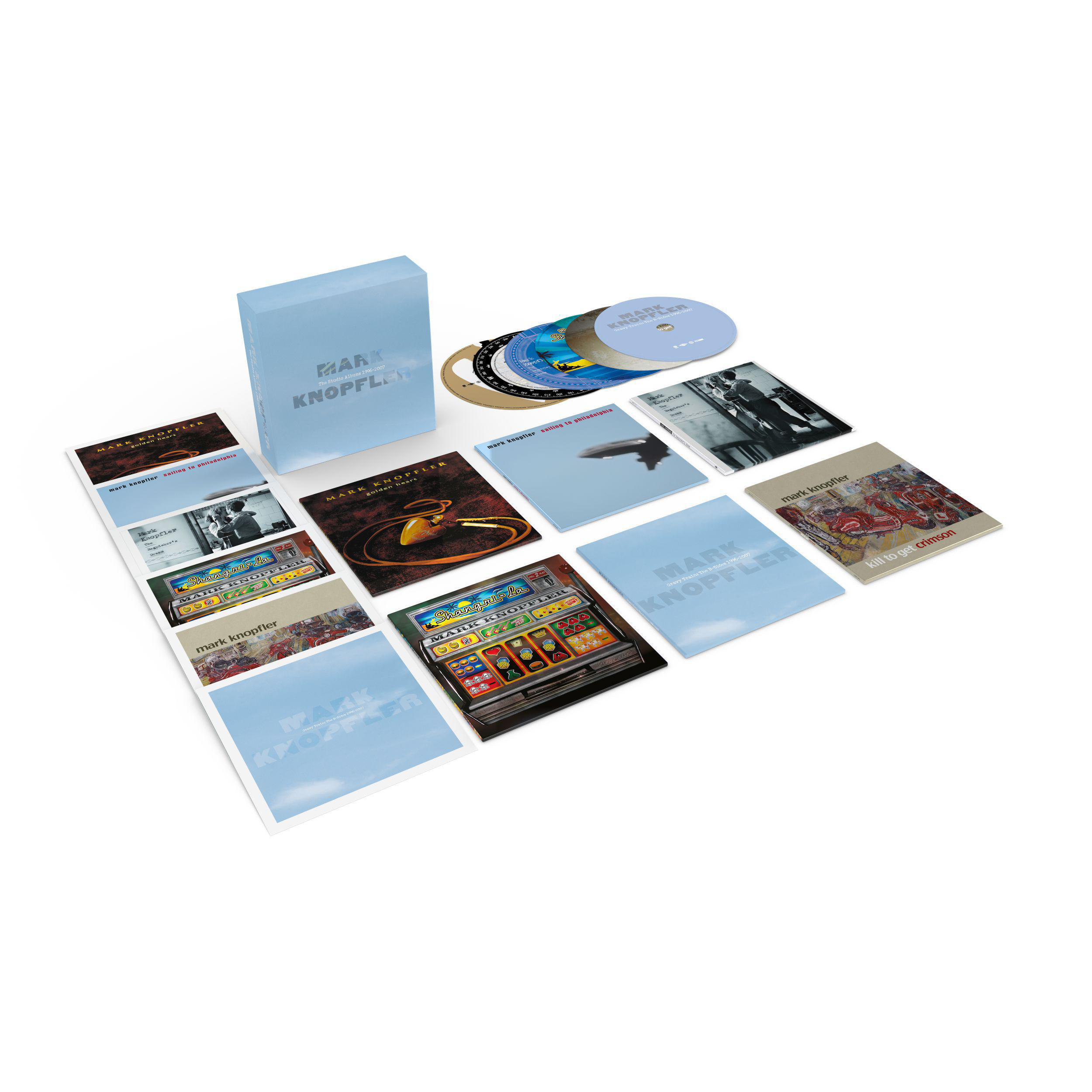 Box-Set mit Musik-CDs und Booklets. Hellblaue Box mit Text 'MARK KNOPFLER'.