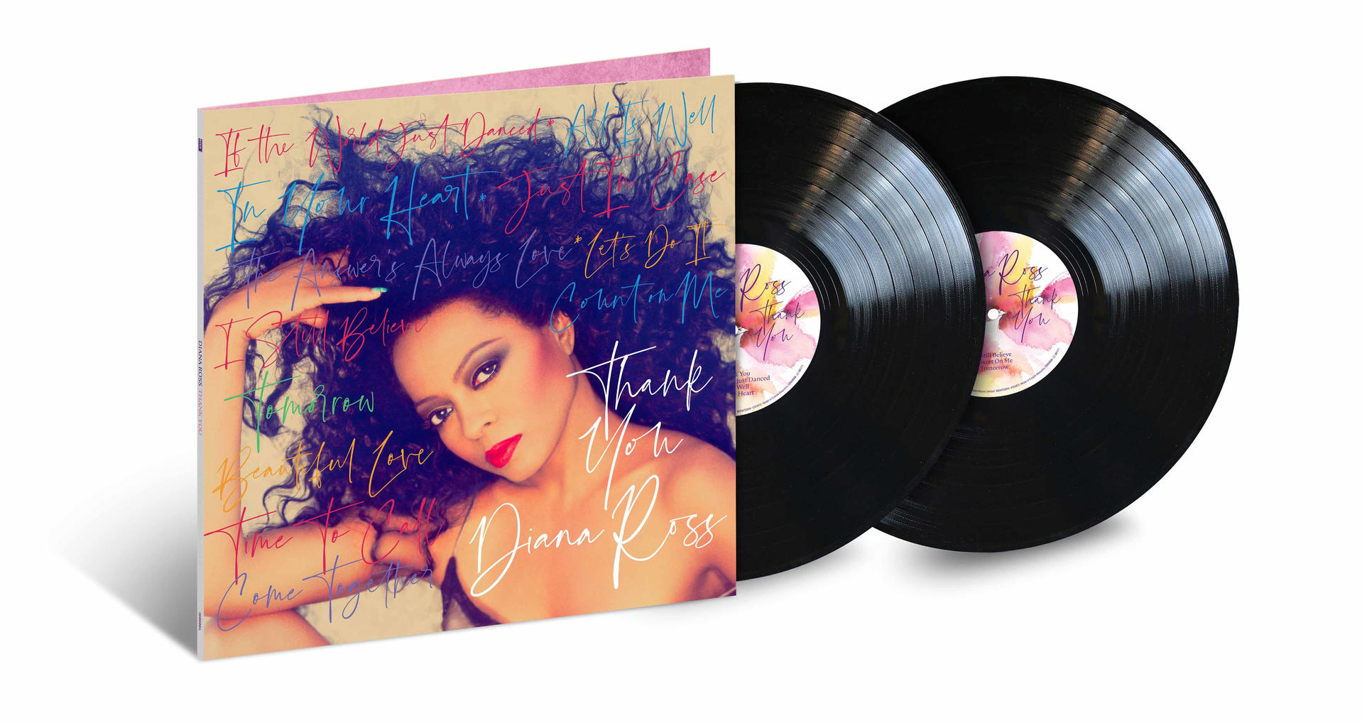 Diana Ross album borítója és két fekete bakelit lemez fehér háttér előtt.