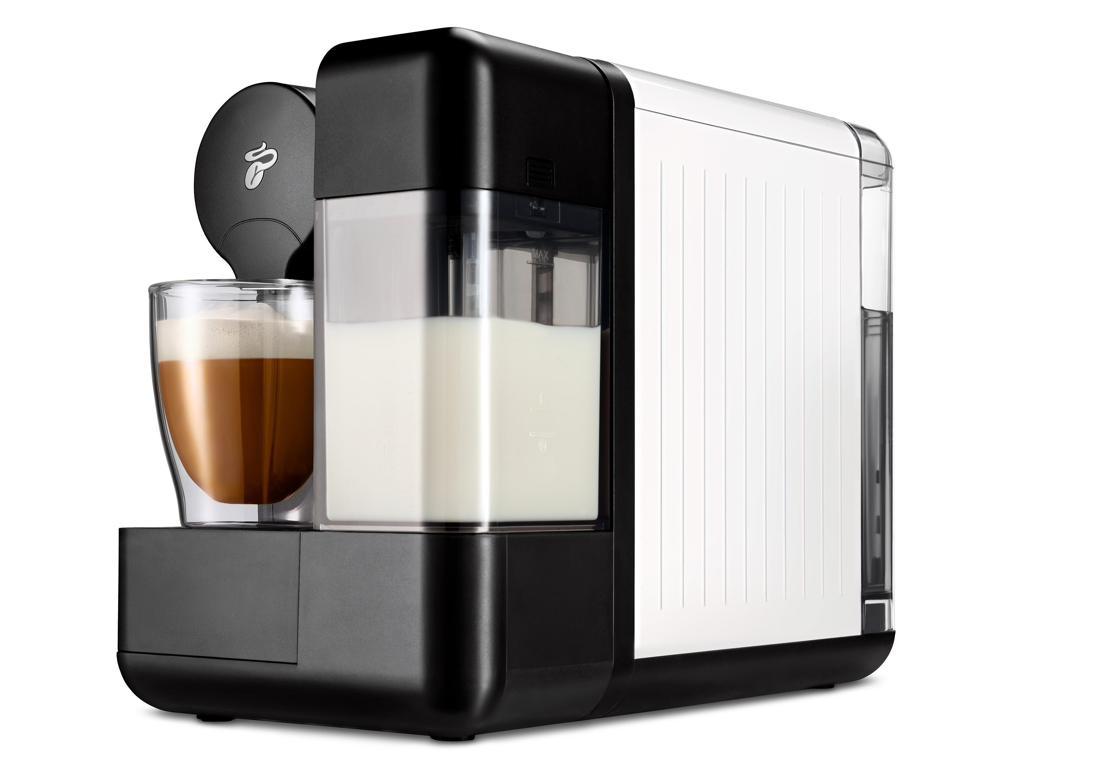 Schwarz-weiße Kaffeemaschine mit Kaffeeglas und Milchbehälter.