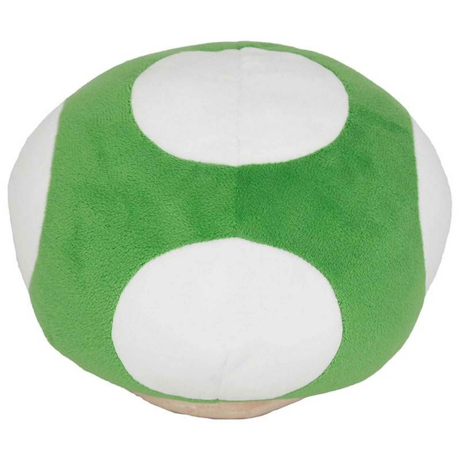 Peluche de hongo verde con manchas blancas, sobre una superficie beige.