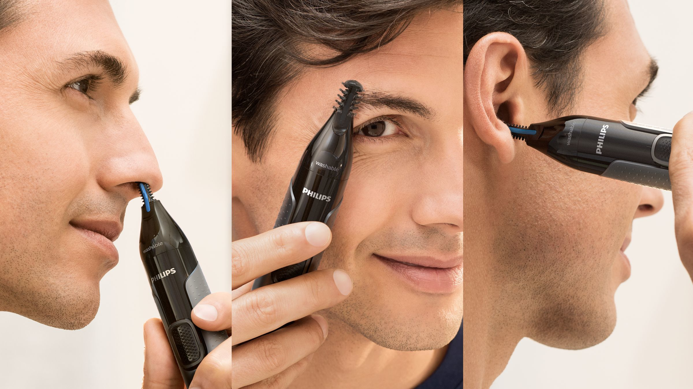 Een man trimt neus-, wenkbrauw- en oorhaar met een zwarte Philips trimmer.