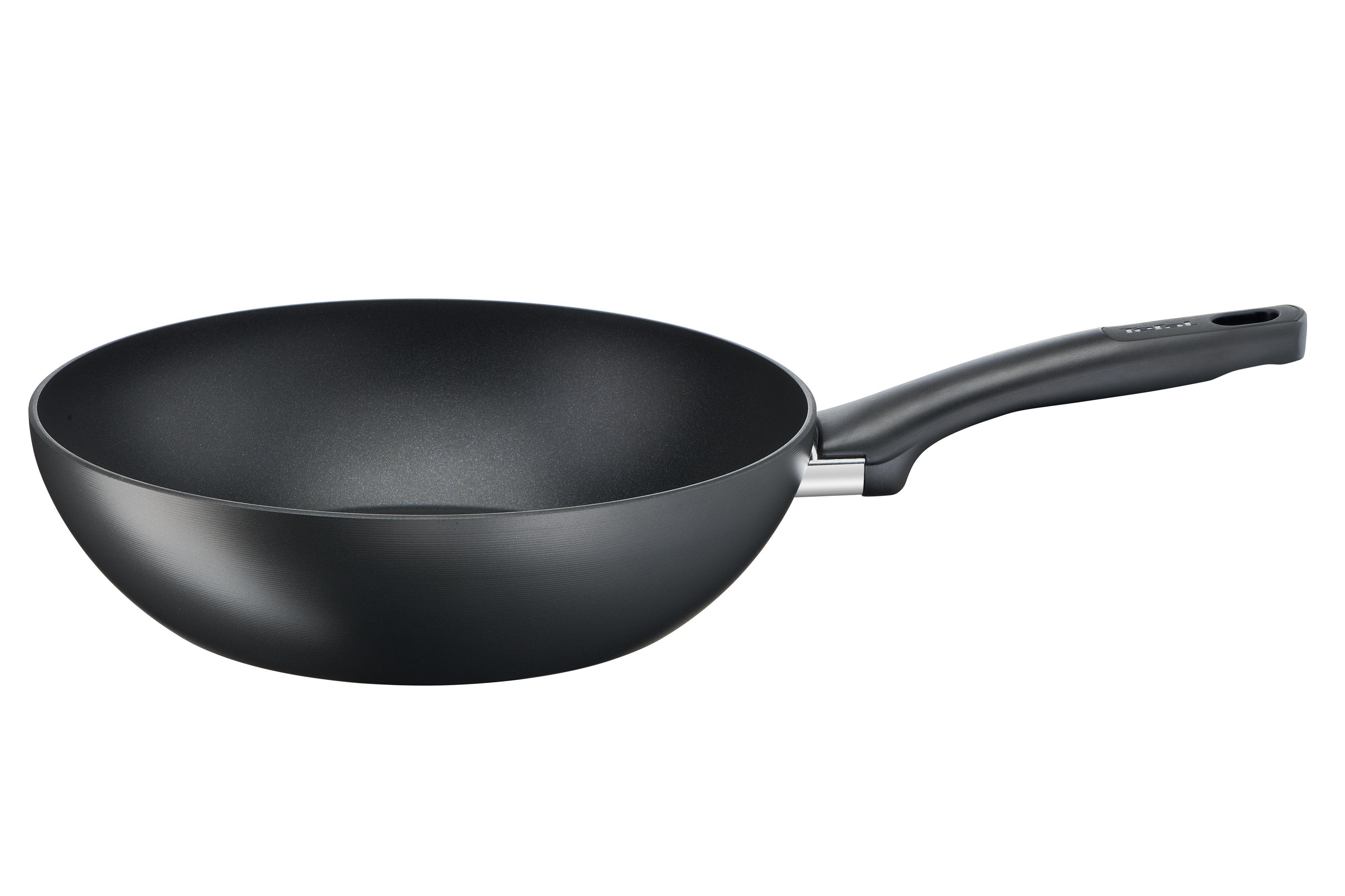 Schwarze Wokpfanne mit schwarzem Griff. Die Pfanne ist leer.
